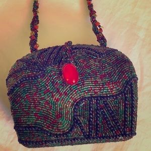 Beaded purse 5” X 7” X 3” With a 12” beaded strap.